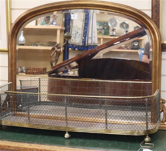 A Victorian style overmantel mirror and a brass mesh fender, mirror W.124cm